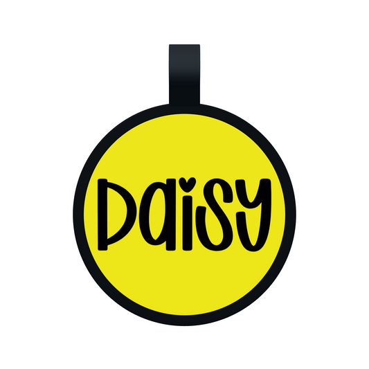 Front preview of a yellow Circle Silicone pet tag personalized with Daisy in Font 14, with a matte black border and attachment loop.